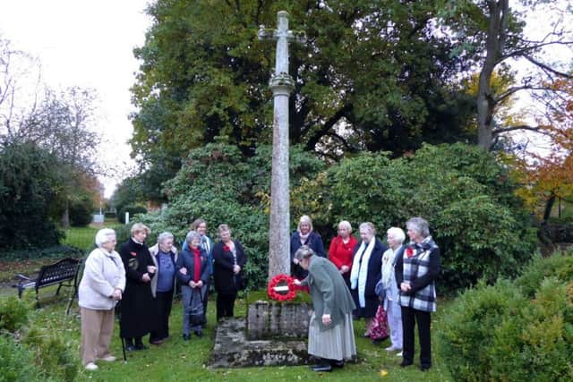 Members of Holton le Moor WI laid a wreath at the village war memorial EMN-181115-074354001