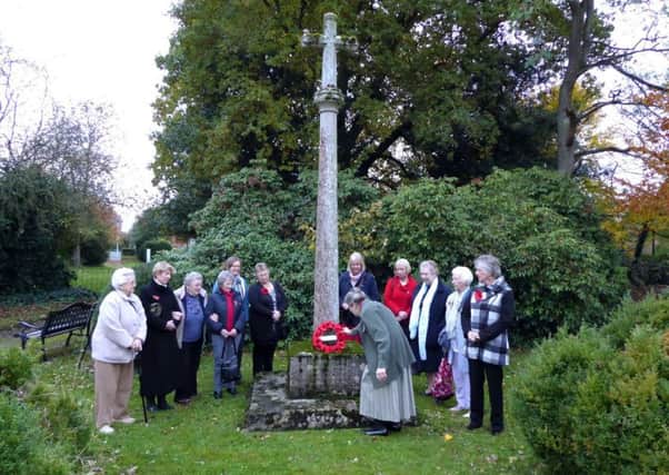 Members of Holton le Moor WI laid a wreath at the village war memorial EMN-181115-074354001