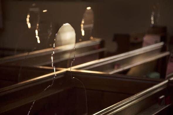 There But Not There silouettes placed in church pews represent the space left by loved ones who do not return from war. ANL-181115-141618001