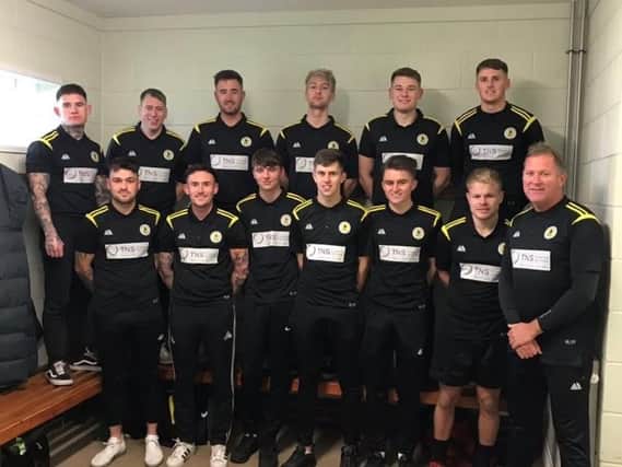 The Colts pose in their new TNS-sponsored polo shirts.