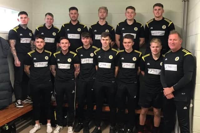 The Colts pose in their new TNS-sponsored polo shirts.