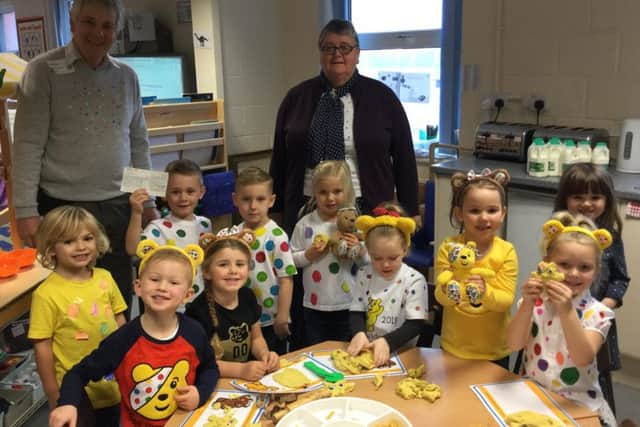 Margaret Taylor and Norman Prime, who is chairman of the Skegness Rotary Club Youth Committee, with Richmond School reception pupils. ANL-181119-112935001