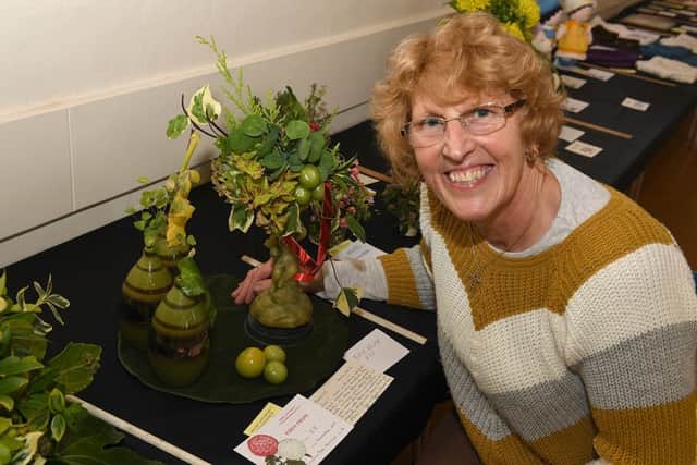 Spilsby and District Chrysanthemum Show. Mary Mackinder of Toynton St Peter with her display that won Best Floral Art.