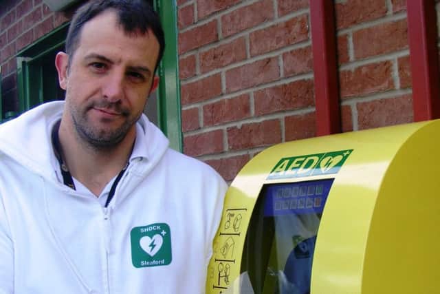 Christian Slingsby of SHOCK Sleaford campaign and the Boston Road defibrillator. EMN-181120-162257001