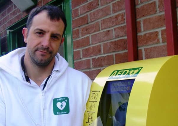 Christian Slingsby of SHOCK Sleaford campaign and the Boston Road defibrillator. EMN-181120-162257001