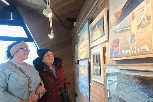 Nancy Ashmore and her great-grandmother Doreen Barnes enjoying the paintings. ANL-181122-133958001