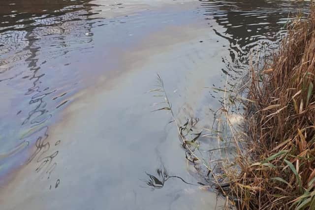 An oil leak in the River Bain. Main photo: Horncastle Community Page.