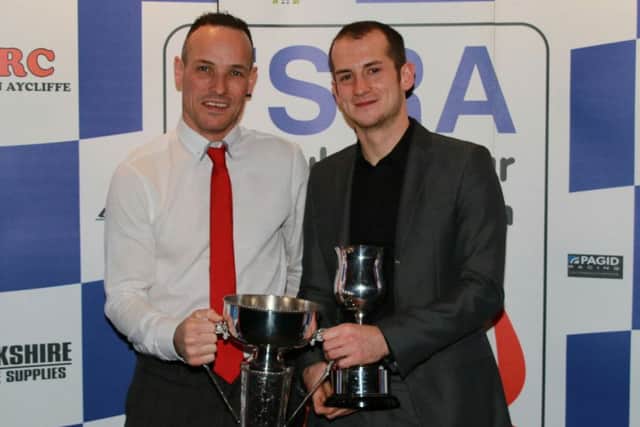 Pete Founds and Jev Walmsley get their hands on the British F2 Championship trophy EMN-181128-172735002