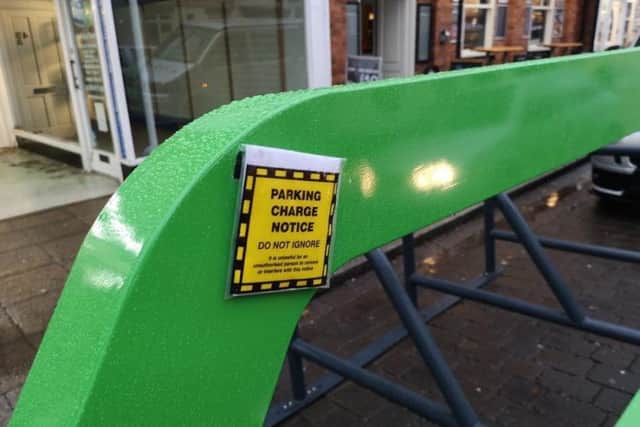 The supposedly 'fake' parking ticket slapped on the cycle rack in Sleaford. Photo: Mark Suffield EMN-181128-182646001