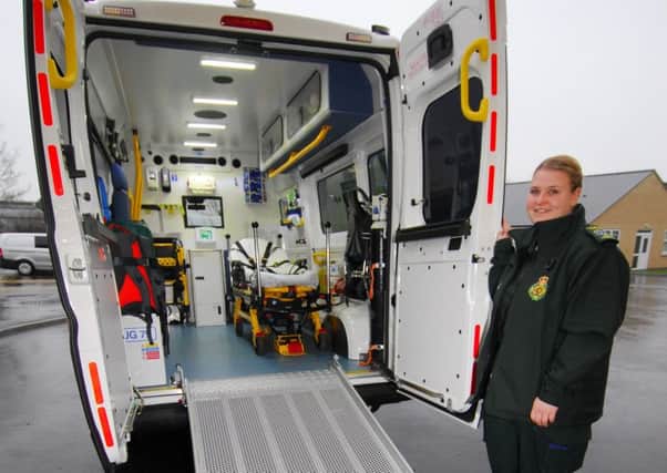Urgent Care Assistant Hannah craig with one of the new non-urgent ambulances now in service based at Sleaford. EMN-181112-145819001