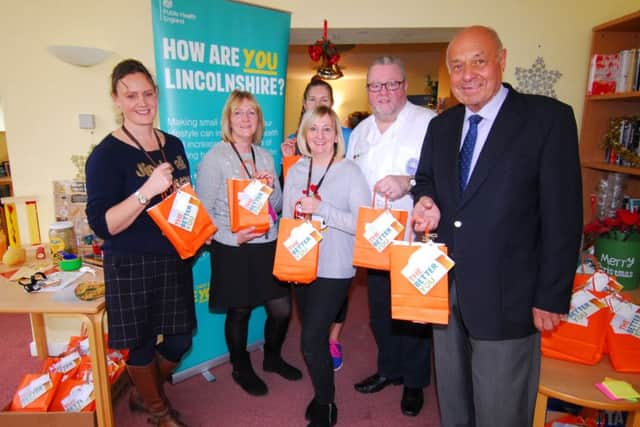 Chairman of NKDC Coun Geoff Hazelwood (right) joins the team encouraging simple tips to live a healthier, happier life at Eslaforde Gardens community centre. EMN-181217-134959001
