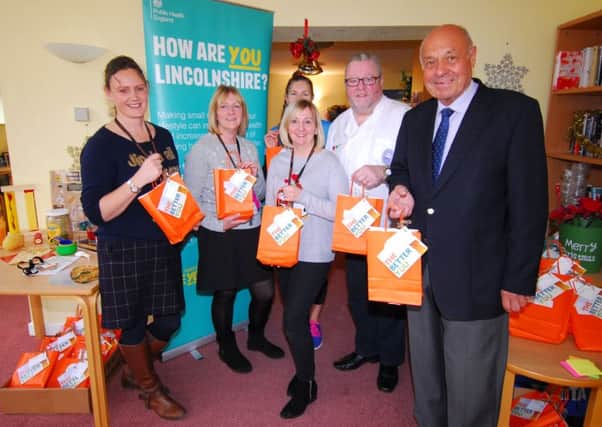 Chairman of NKDC Coun Geoff Hazelwood (right) joins the team encouraging simple tips to live a healthier, happier life at Eslaforde Gardens community centre. EMN-181217-134959001
