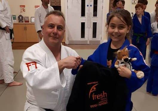 Scarlet Atkins with Sensei Mark Mason.