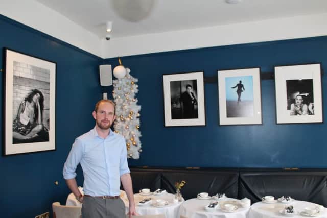 The Masons Arms manager, Alex Sweeney, is pictured above with some of the artwork.