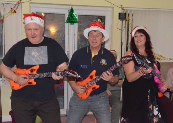 Rotary Club members entertain residents at Eslaforde Gardens community centre in Sleaford. Photo: James Duckett. EMN-181217-163808001
