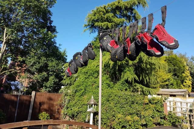 Dexter's fire boots pegged out on the line at home. ANL-181217-135442001