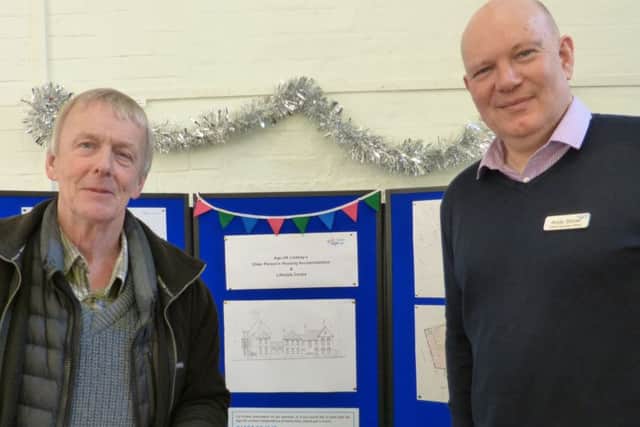 Age UK Lindseys Chief Executive Officer Andy Storer (right) shows resident David Birchall the new plans.