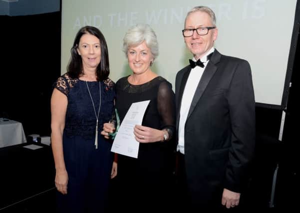 Award-winner Tracey (centre) with LCHS chair Elaine Baylis and chief executive Andrew Morgan.