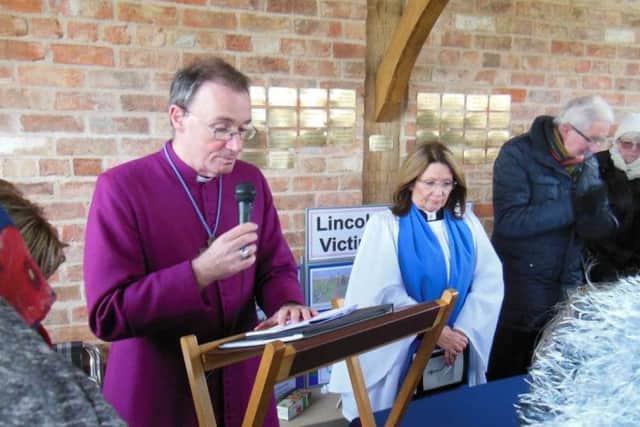 The Righ Rev Nicholas Chamerlain blesses the structure.