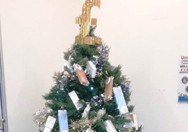 Sleaford Medical Group's tree decorated with returned medication. EMN-181221-121810001