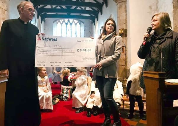 The Rev Chris Hewitt presented a cheque for more than Â£1,400 raised at a Christmas concert in Tealby earlier this month.