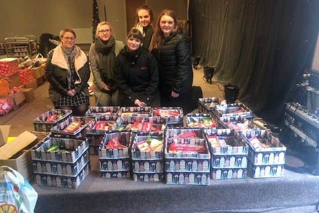 Butlins team members Sallie Turner, Sharon Swannack, Abbie Mitchell, Chelsea Barlow and Sarah Baumber deliver the festive hampers. ANL-181220-075540001
