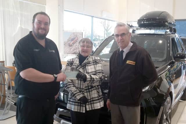 Lawrence Muxlow handed over a cheque for £50 to Ambucopter representatives Anne and Geoff Crawforth EMN-181220-134506001