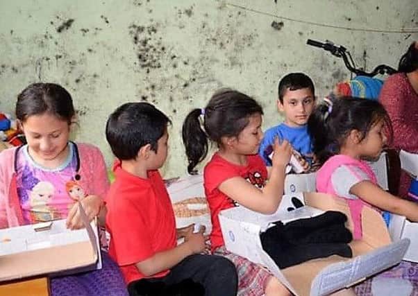 Children in Kiev with their donations.