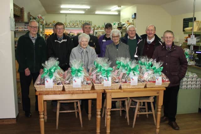 Members with the Christmas hampers ready to go out.