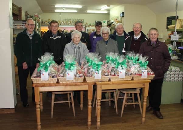 Members with the Christmas hampers ready to go out.