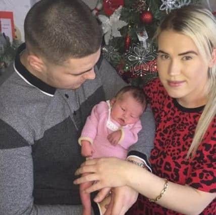 Zia Farrell and Daniel Brown with baby Taome. ANL-181231-070848001