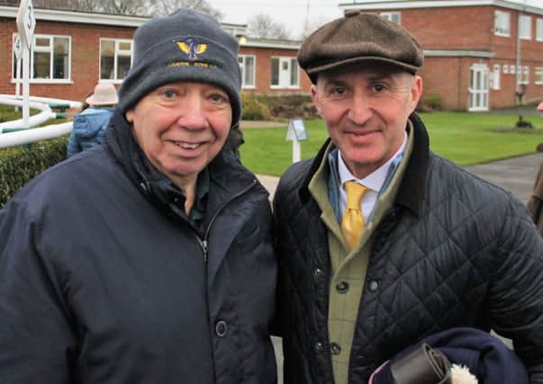 Brigg Trainer Nick Kent (right) celebrates with his friend and Caistor Cricket Club stalwart Wes Allison after his superb Boxing Day success at Market Rasen. EMN-181227-120919002