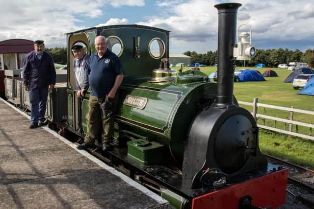 Jurassic with three original 1960/1961 volunteers, still active - l-r Jim Smith,  Mick Allen (on the footplate), Chris Bates. ANL-181227-143008001