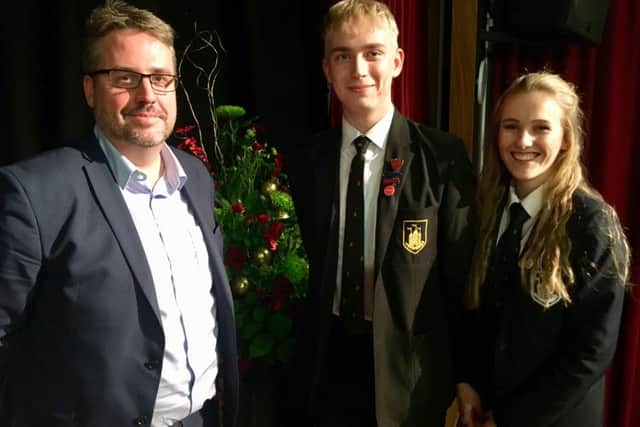 Tim Shipman is pictured with Head Boy Tom Massey and Head Girl Joanna Ward.