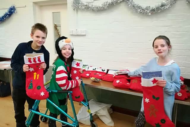 Luca, Casey and Carmel Burke who were among the volunteers at the lunch EMN-181227-153452001