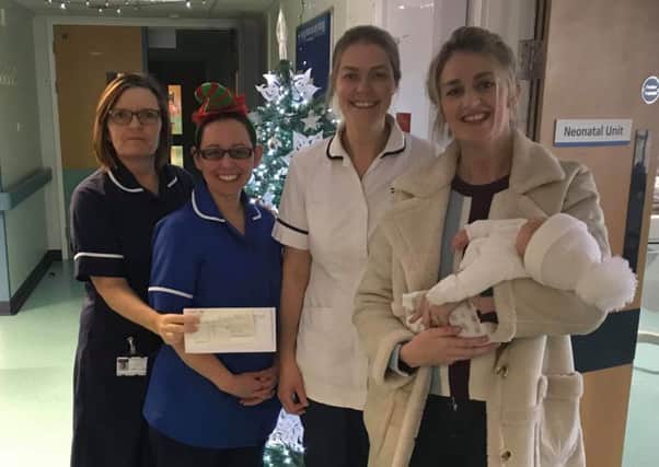 Early Years Foundation Stage teacher Beccy Sharpe and  her son, Ruben, at Pilgrim Hospital in Boston to present a cheque to the neonatal team at the hospital. ANL-181228-084216001