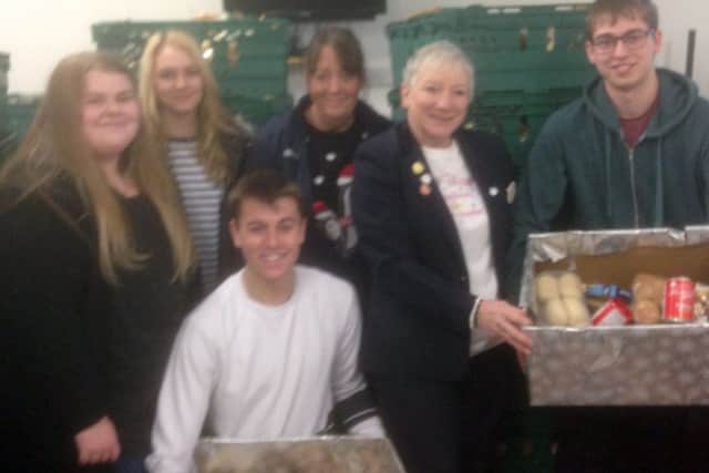 Rachel Bell and Jane Goodyear from Tesco along with Mark Bedford, Daisy Chambers, Joe Dodd, Jess Welch of De Aston Sixth Form EMN-181228-174854001