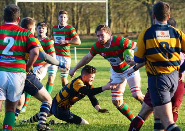 Red and Greens skipper Ben Chamberlain looks for a way through