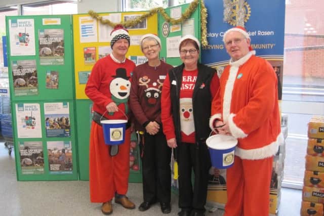 Rotarians Ron Myland and Stuart Davies with Debbie and Maggie from Caistor Co-op EMN-181231-065806001