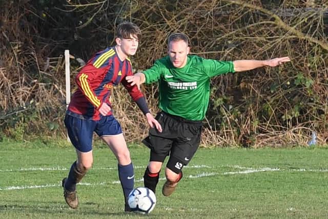 Railway Res (green) v Coningsby (red). Lucas Dakin (red), Tom Flatters (green).