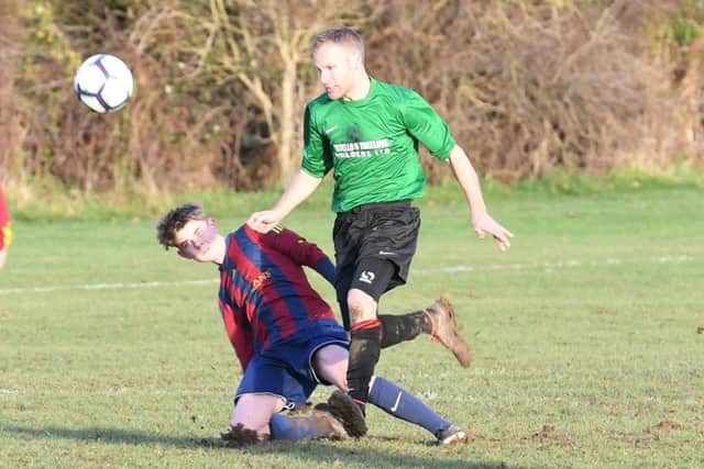 Railway Res (green) v Coningsby (red). Lucas Dakin (red), Ellis Smith (green).