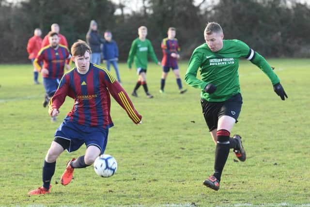 Railway Res (green) v Coningsby (red). Jenson Bark (red), Nathan Garfoot (green)