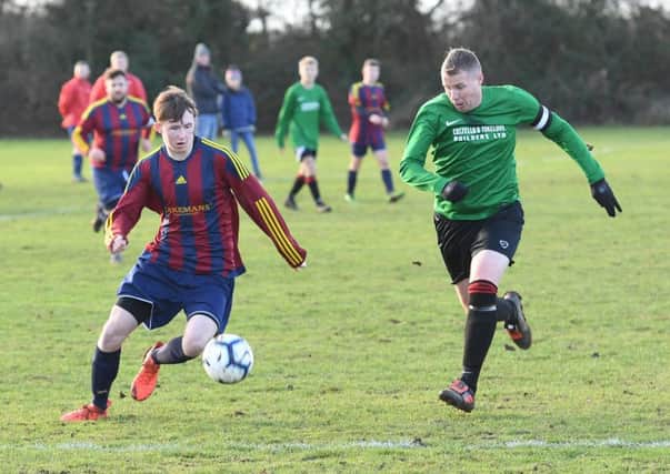 Railway Res (green) v Coningsby (red). Jenson Bark (red), Nathan Garfoot (green)