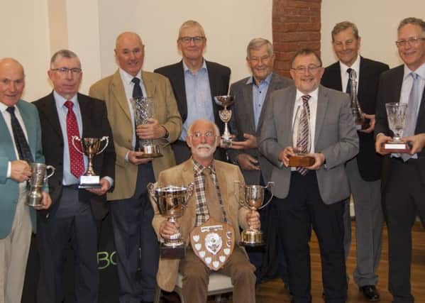 The Boston West senior golfers trophy winners 2018 are, from left, Tony Taylor, John Baker, Phil Thomas, Stewart Needham, Geoff Upsall, Graham Squires, Les Martin and Simon Cooper. Seated is John Wade.