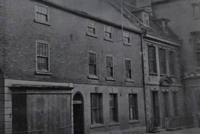 An old photo of the premises now occupied by Lloyds Bank dated around 1800. EMN-190401-141802001