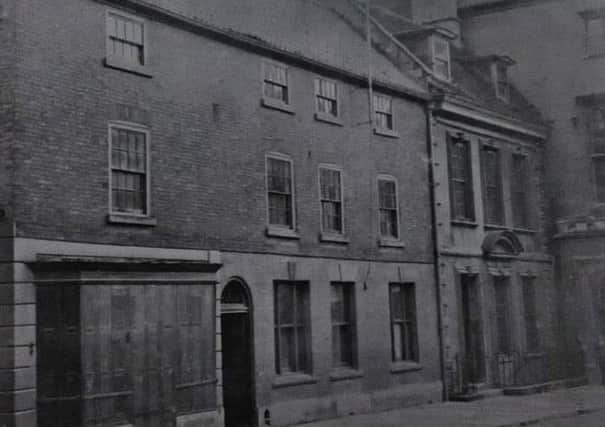 An old photo of the premises now occupied by Lloyds Bank dated around 1800. EMN-190401-141802001
