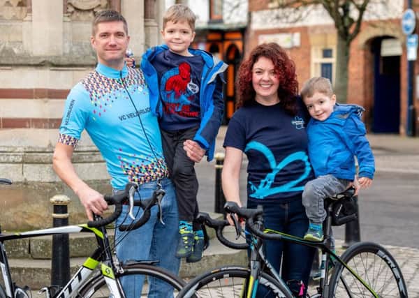 Wheels  of fortune:  Husband and wife  Nick and Kelly Mowbray with children Jacob (5) and George (3). Picture: John Aron.