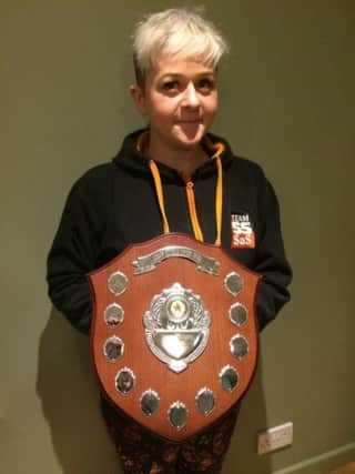 Jen Stainton with her award from the Scottish Sidecar Racing Club EMN-190301-145129002
