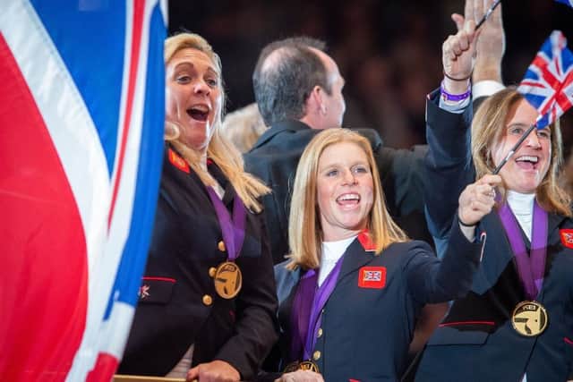 Ros (middle) with team-mates Gemma Tattersall (left) and Piggy French as the gold medal-winning British team parade at The London International Horse Show at Olympia. Picture courtesy of BEF/Jon Stroud Media EMN-190301-170113002