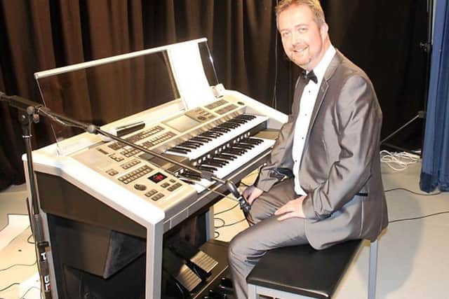 Organist John Cooper EMN-190401-150553001